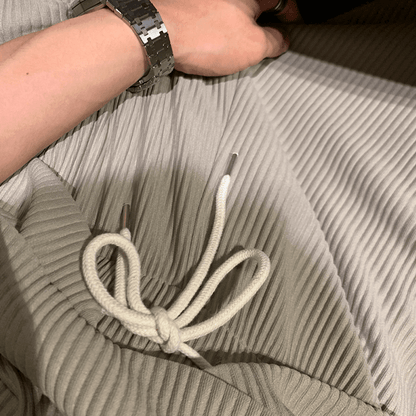PLEATED SLEEVELESS SHIRT & WIDE DRAWSTRING PANTS